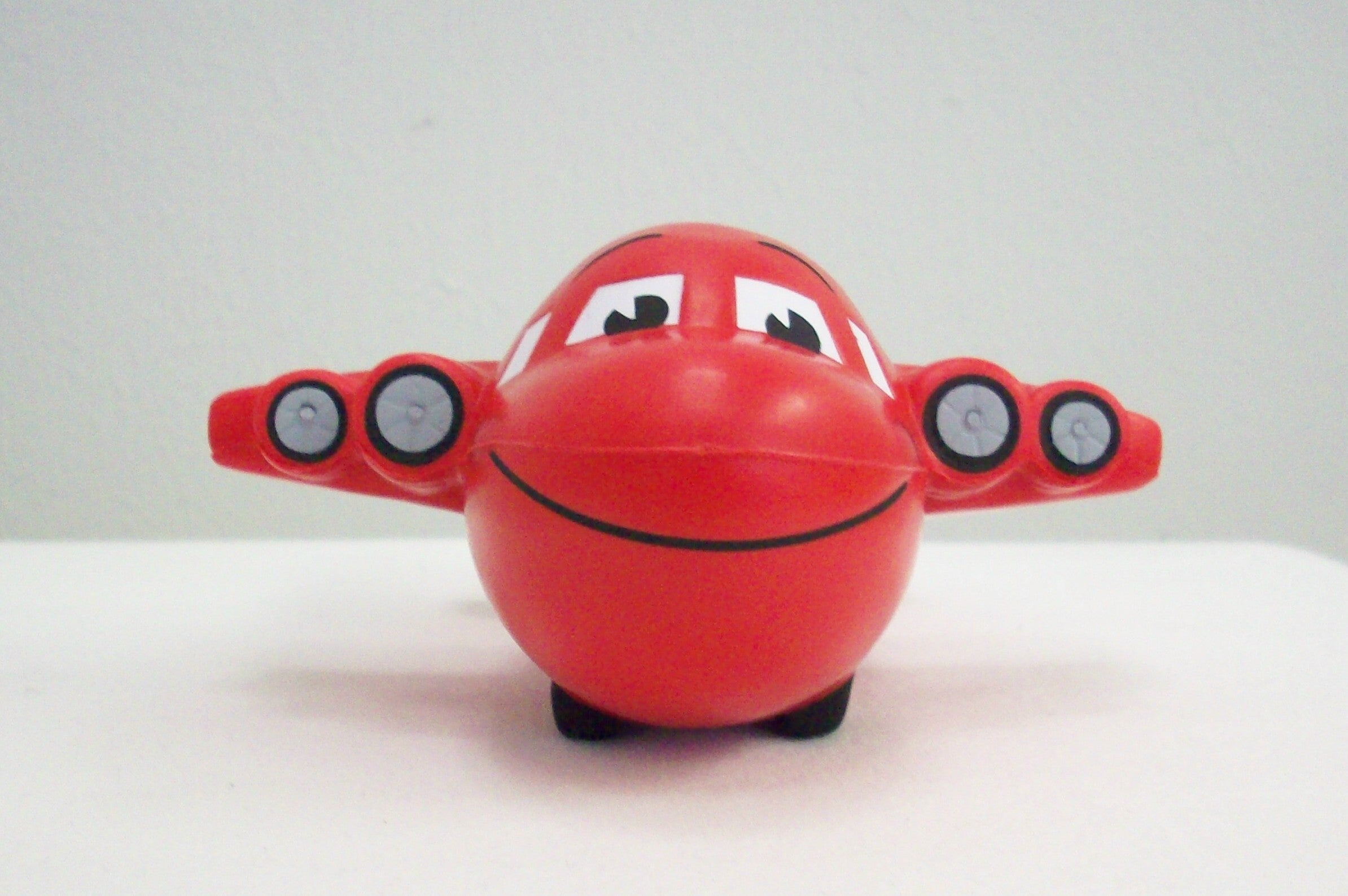 Stress Reliever Smiley Airplane Red